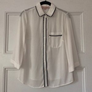 Cream Blouse With Black Trim and Front Pocket